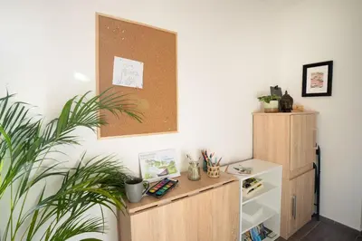 a room with a desk and a potted plant at Pretty Jolie Romantic Getaway in Bled