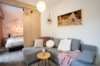 a living room with a couch and a bed at Pretty Jolie Romantic Getaway in Bled