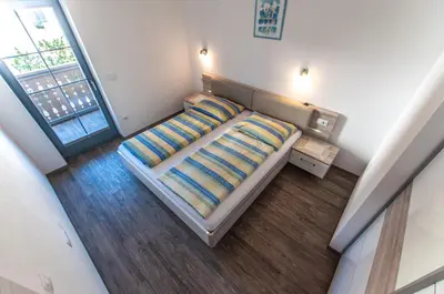 an overhead view of a bed in a bedroom at Apartments Francka in Bohinj