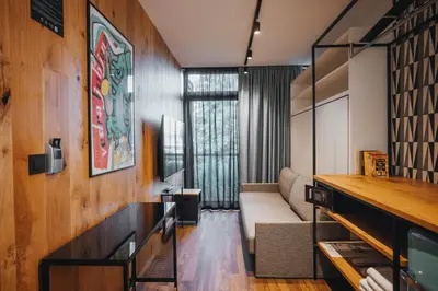 a living room with a couch and a table at City Glamping by ONE66 Hotel in Ljubljana