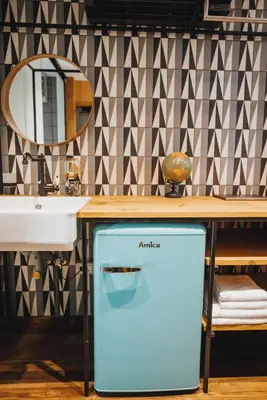 a bathroom with a sink and a mirror at City Glamping by ONE66 Hotel in Ljubljana