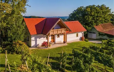 a house with an orange roof and a yard at Stunning Home In Velika Nedelja in Velika Nedelja