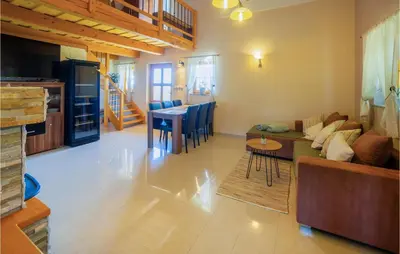 a living room with a couch and a table at Stunning Home In Velika Nedelja in Velika Nedelja