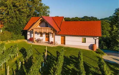 a house with an orange roof on a green field at Stunning Home In Velika Nedelja in Velika Nedelja