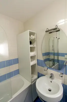 a bathroom with a sink and a mirror and a tub at Apartments Bohinjskih 7 in Bohinj
