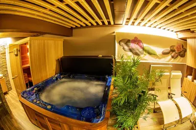 a room with a jacuzzi tub in a room at Apartments Bohinjskih 7 in Bohinj