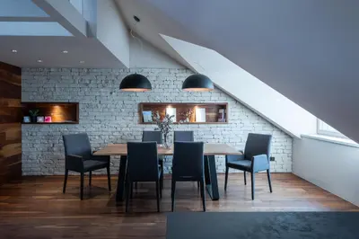 a dining room with a table and chairs at Authentic City Stay in Ljubljana