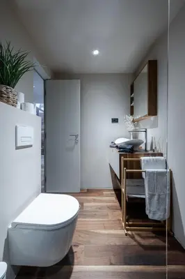 a bathroom with a white toilet and a sink at Authentic City Stay in Ljubljana