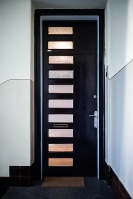 a black door leading into a room with at Cozy apartment in heart of Maribor / big terrace in Maribor