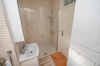 a bathroom with a shower and a sink at Apartma Golob in Maribor