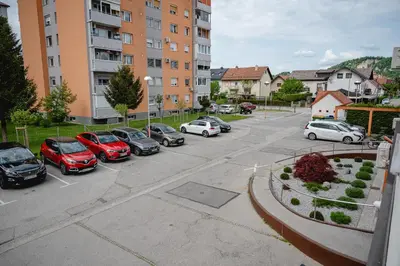 a bunch of cars parked in a parking lot at Apartma Golob in Maribor