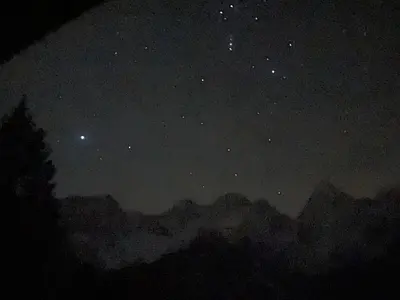 a starry night with the milky way in the sky at Idyllic Retreat Next to an Elven Forest in Gozd Martuljek