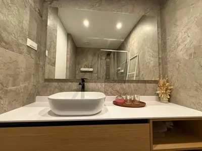 a bathroom with a sink and a mirror at Penthouse Apartment - Garden Residence in Ljubljana