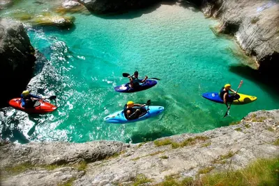 a group of people in kayaks in a river at Apartment Kolman in Tolmin