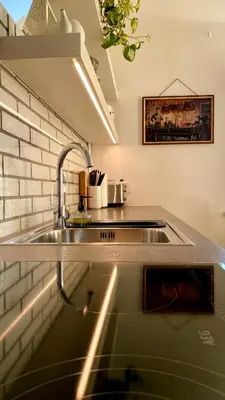 a kitchen with a sink and a counter top at Little Plaza City Centre in Ljubljana