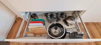 a bunch of utensils in a drawer in a kitchen at Little Plaza City Centre in Ljubljana