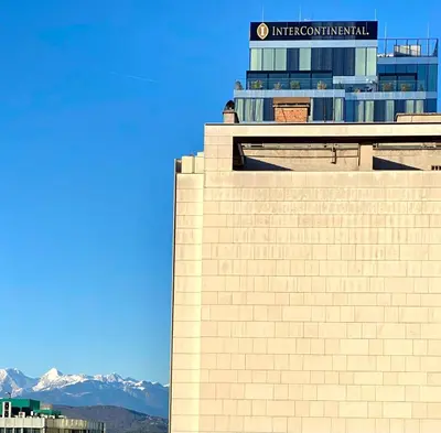 a building with a sign on top of it at Little Plaza City Centre in Ljubljana