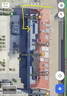 a map of a street with buildings and a yellow arrow at Little Plaza City Centre in Ljubljana