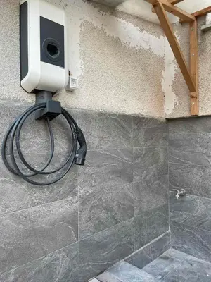 a speaker on the side of a wall with a hose at Laibach Suite in Ljubljana