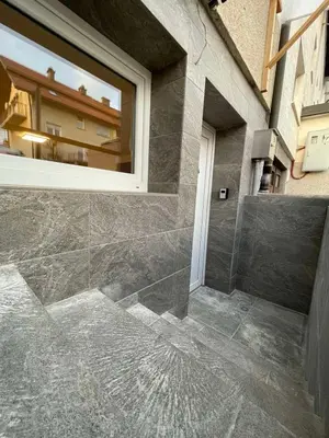 a bathroom with a window and a tile floor at Laibach Suite in Ljubljana