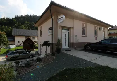 a car parked in front of a building at Viktoria Apartments in Bled