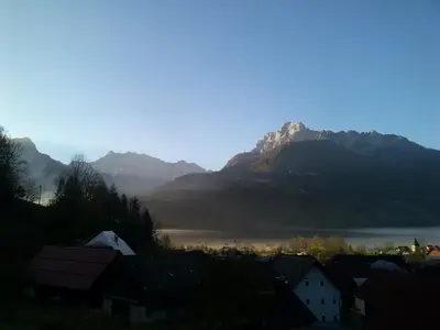 a view of a town with mountains and a lake at Apartment Leposa in Kranjska Gora