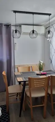 a dining room with a table and chairs at Time4you in Čatež ob Savi