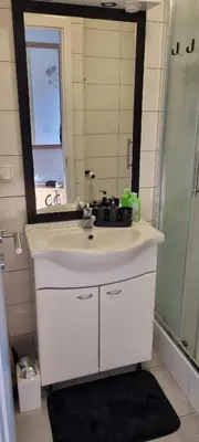 a bathroom with a sink and a mirror at Time4you in Čatež ob Savi