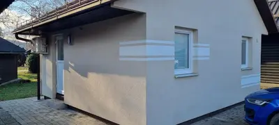a side of a white house with a window at Time4you in Čatež ob Savi