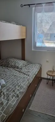 a bunk bed in a room with a window at Time4you in Čatež ob Savi