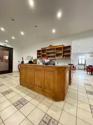 a large kitchen with a large island in a room at Gostišče Barbara in Idrija