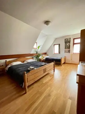 a bedroom with a large bed in a room at Gostišče Barbara in Idrija