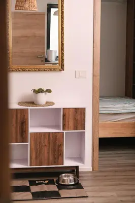 a mirror on a wall next to a bedroom at Apartma Dreamscape in Radovljica