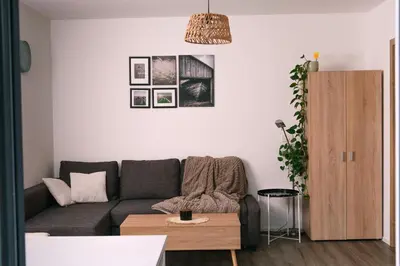 a living room with a couch and a table at Apartma Dreamscape in Radovljica