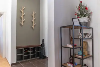 a room with two shelves and a wall at Old Town's Legend: City center condo with balcony in Maribor