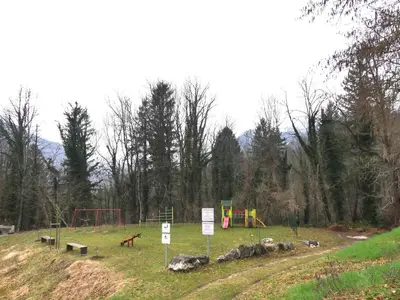 a park with a playground in a field at Happy nes.t in Bovec