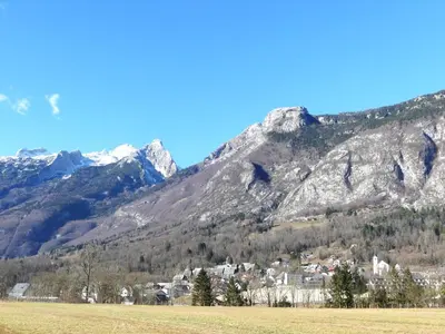 a village in front of a mountain at Happy nes.t in Bovec