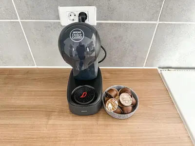a blender sitting on a counter next to a bowl of food at The North Apartment in Ljubljana