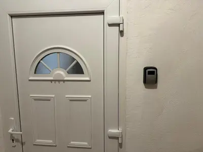 a white door with a window on it at The North Apartment in Ljubljana