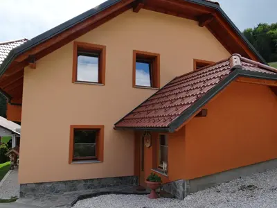 a house with a brown roof at Apartments Trebušak in Laze v Tuhinju