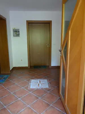 a room with a tile floor with a cross on it at Apartments Trebušak in Laze v Tuhinju