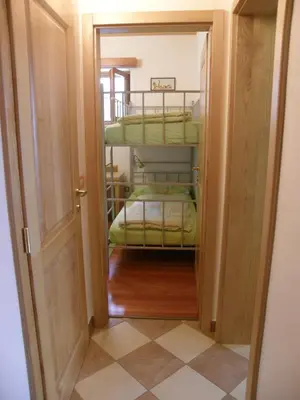 a small room with two bunk beds in it at Apartment Šavli in Kobarid