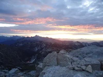 a sunset on the top of a mountain at Apartment Šavli in Kobarid