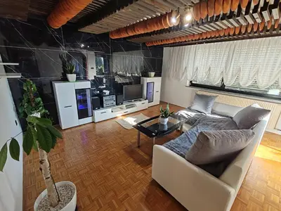 a living room with a couch and a tv at Apartment Prešeren in Smarjeske Toplice