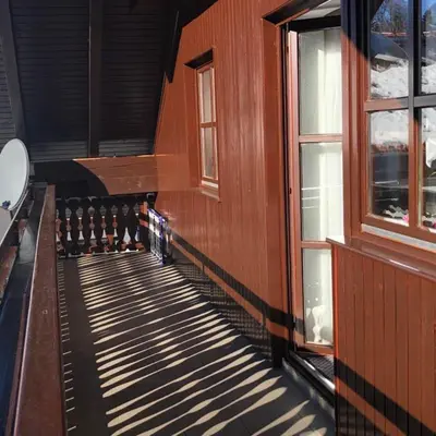 a hallway of a train with windows on it at Apartma ČVRSTA TROJKA in Jesenice
