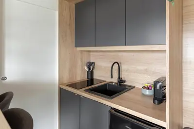 a kitchen with a sink and a counter top at Apartma LeMa in Velike Lašče