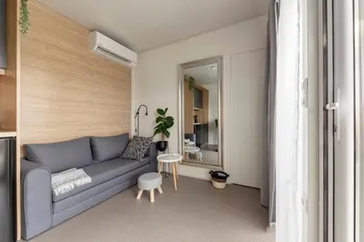 a living room with a couch and a table at Apartma LeMa in Velike Lašče