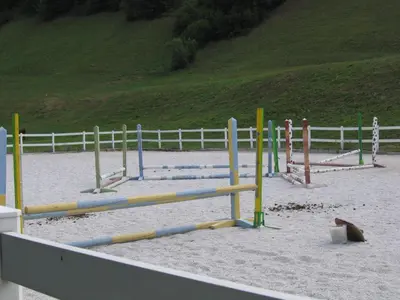 a beach with a bunch of play equipment in the sand at Apartment Sever in Idrija