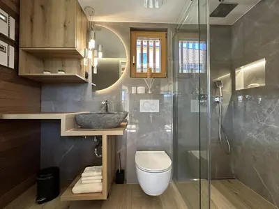 a bathroom with a sink and a toilet and a shower at Luxury Resort Potatoland in Šenčur