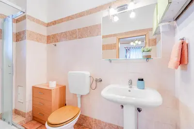 a bathroom with a toilet and a sink at Apartma Brešan in Kobarid